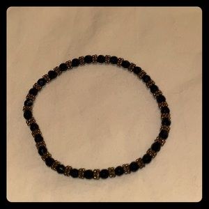 Stretchy bracelet. Gold and black
